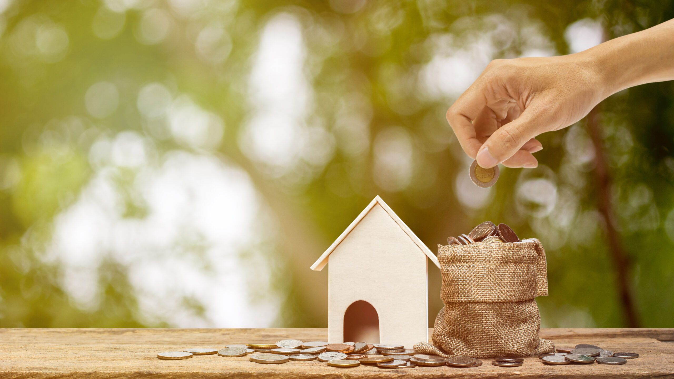 Saving money, home loan, mortgage, a property investment for future concept.